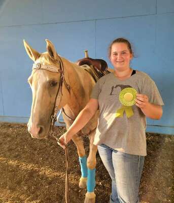Trista Trivette 7th place with her 7th place ribbon in Pony Barrel Racing with Peppy