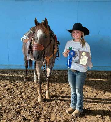 Kaelynn Bartels 1st place Pole Bending plaque with her horse Hannah