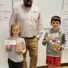 Winners from Ms. McCubbins' class were Violet and Owen.  They are picture with Brandon Graupman from Regional Missouri Bank.