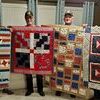 Veterans with their quilts from the Peacemakers Quilt Guild. L-R: Chuck Widaman, Keith Payne, John Booth, & Henry Rousch.