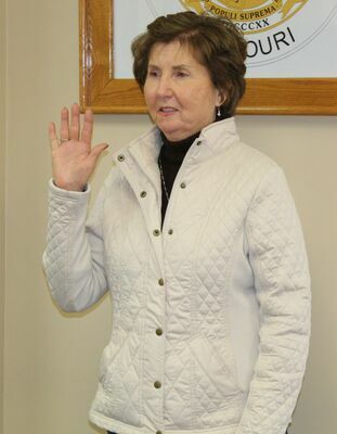 Paula Evans, re-elected Public Administrator, is sworn in.