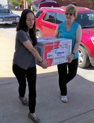 Pictured unloading the units are NECAC Ralls County Service Coordinator Miranda Anderson, left, and NECAC County Services Programs Director Linda Fritz