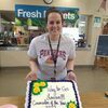 staff surprised Mrs. Jones with a cake and balloons at lunch to celebrate